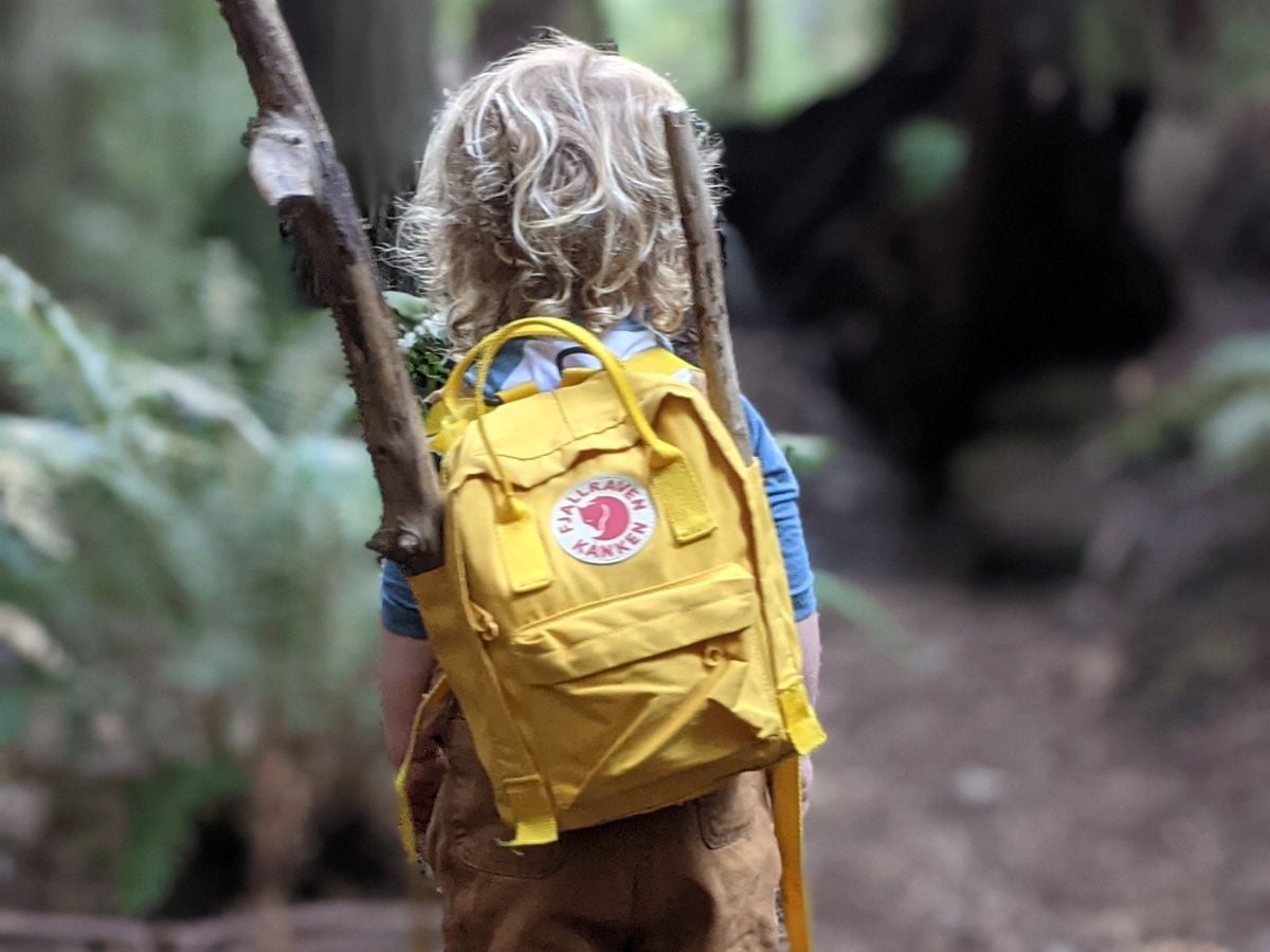 Best Hiking Backpacks for Kids - Horizontal 2 Little kid wearing the kanken backpack in yellow