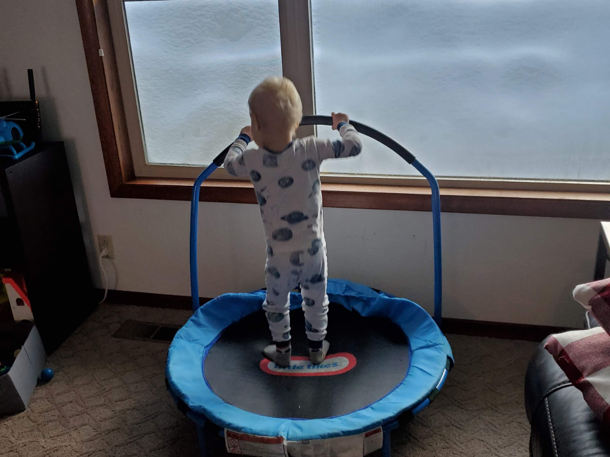 Best indoor active play gifts horizontal 6 Little boy in pajamas jumping on little tikes trampoline