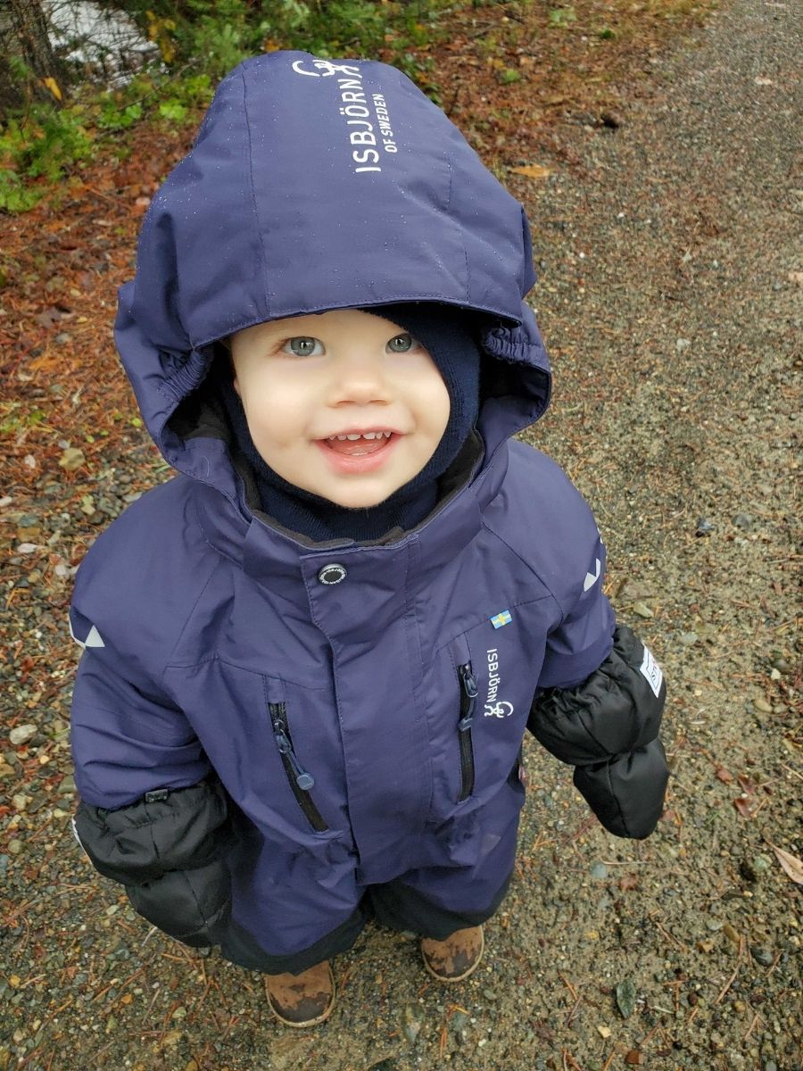 child in snow gear in the winter