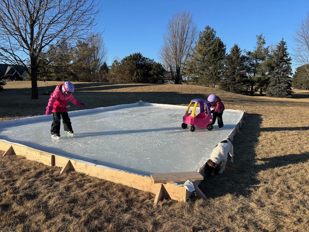 Enjoying a Winter with No Snow 1 Kids skating on a homemade ice rink