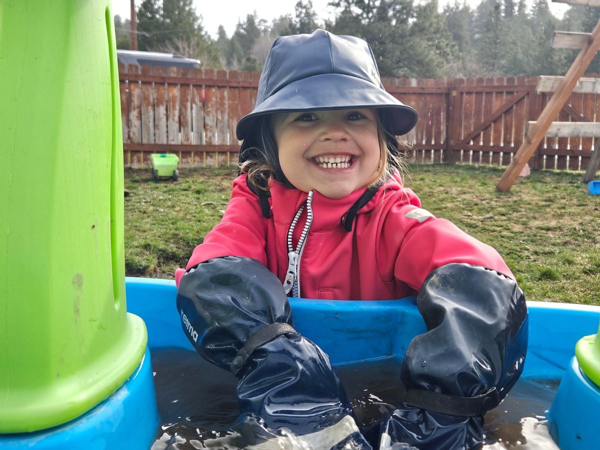 Easter Baskets for Outdoor Kids - Horizontal 10 Little Girl in Reima rain mittens playing in water
