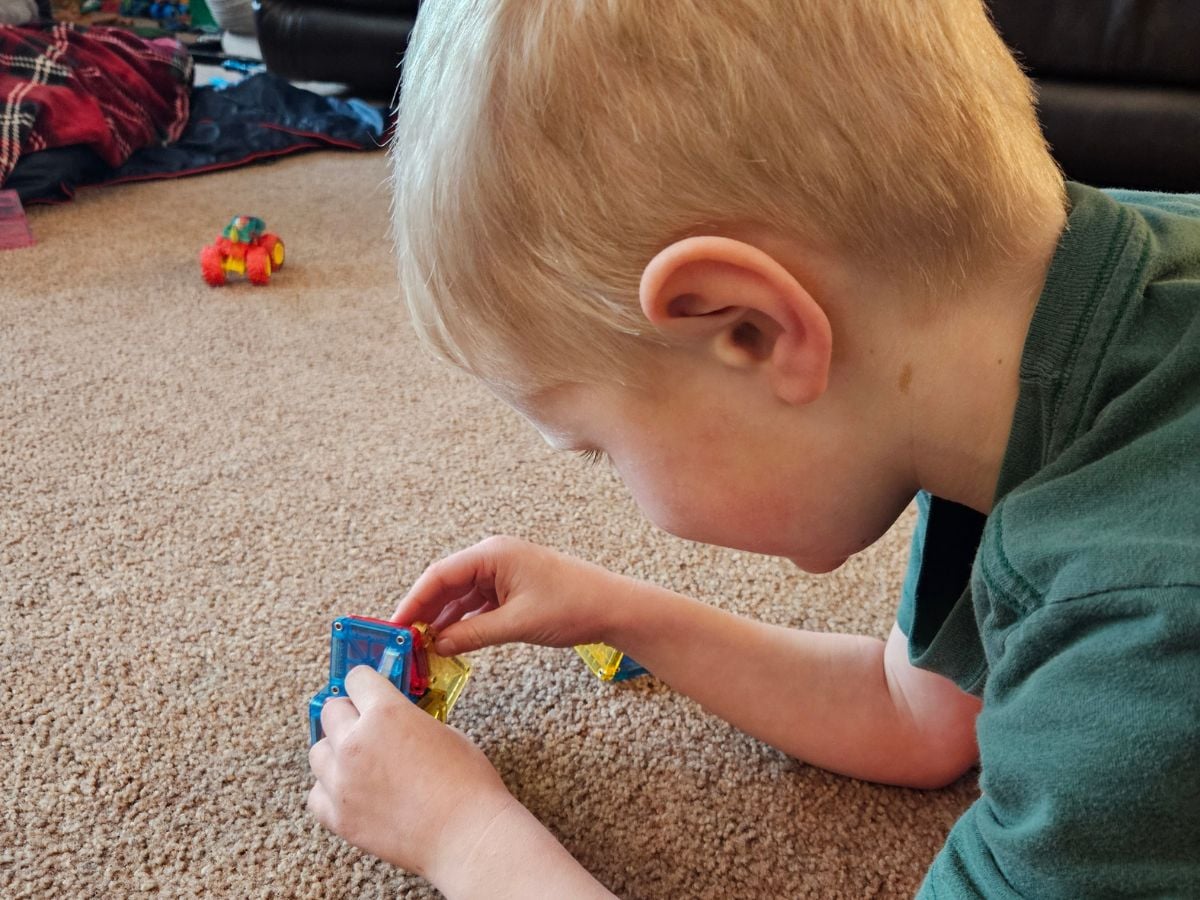 Easter Baskets for Outdoor Kids - Horizontal 11 Little boy playing with mini magnatiles