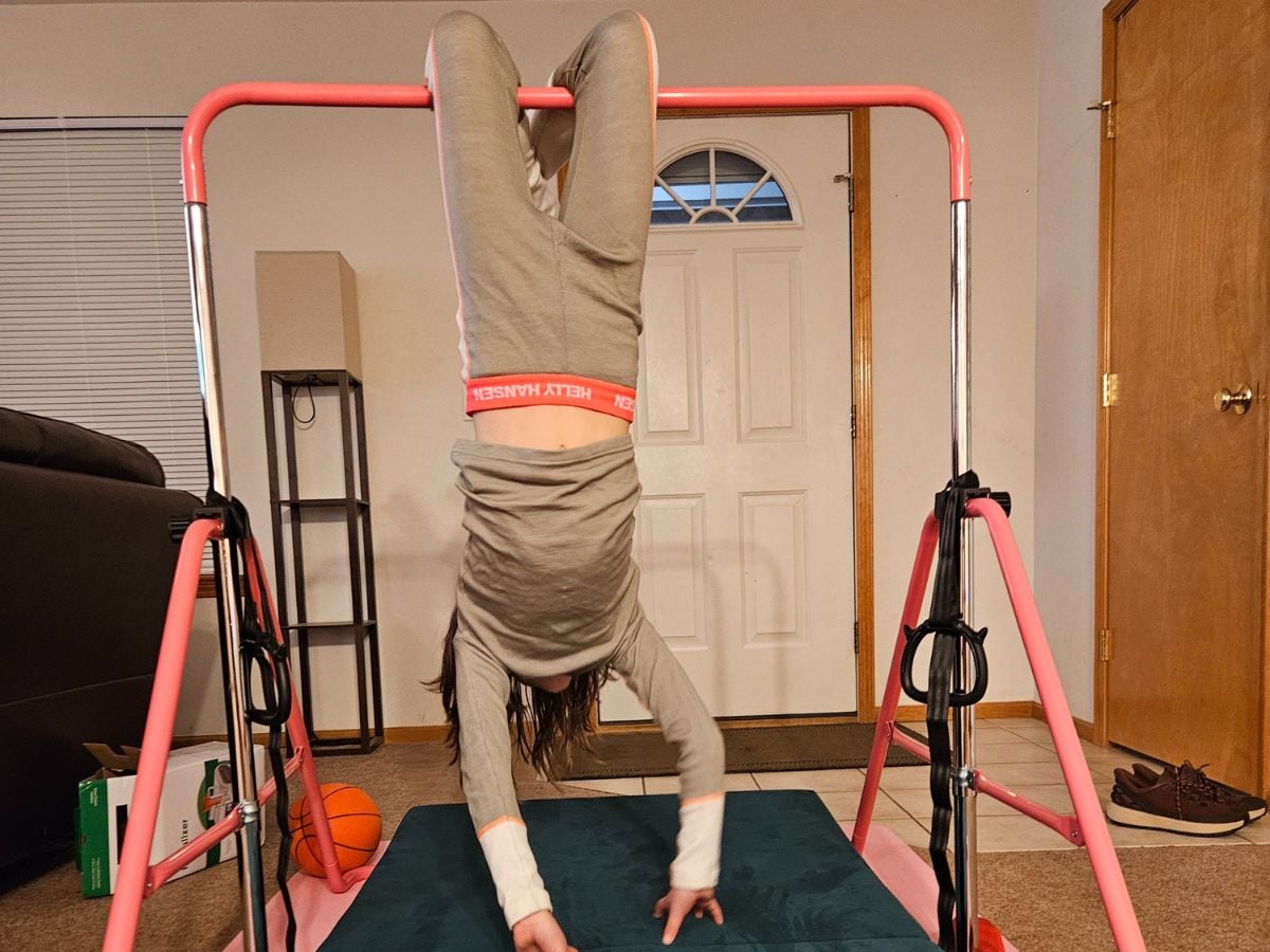 Best Base layers for kids Horizontal -6 preteen hangs from bar while wearing Helly Hansen base layers