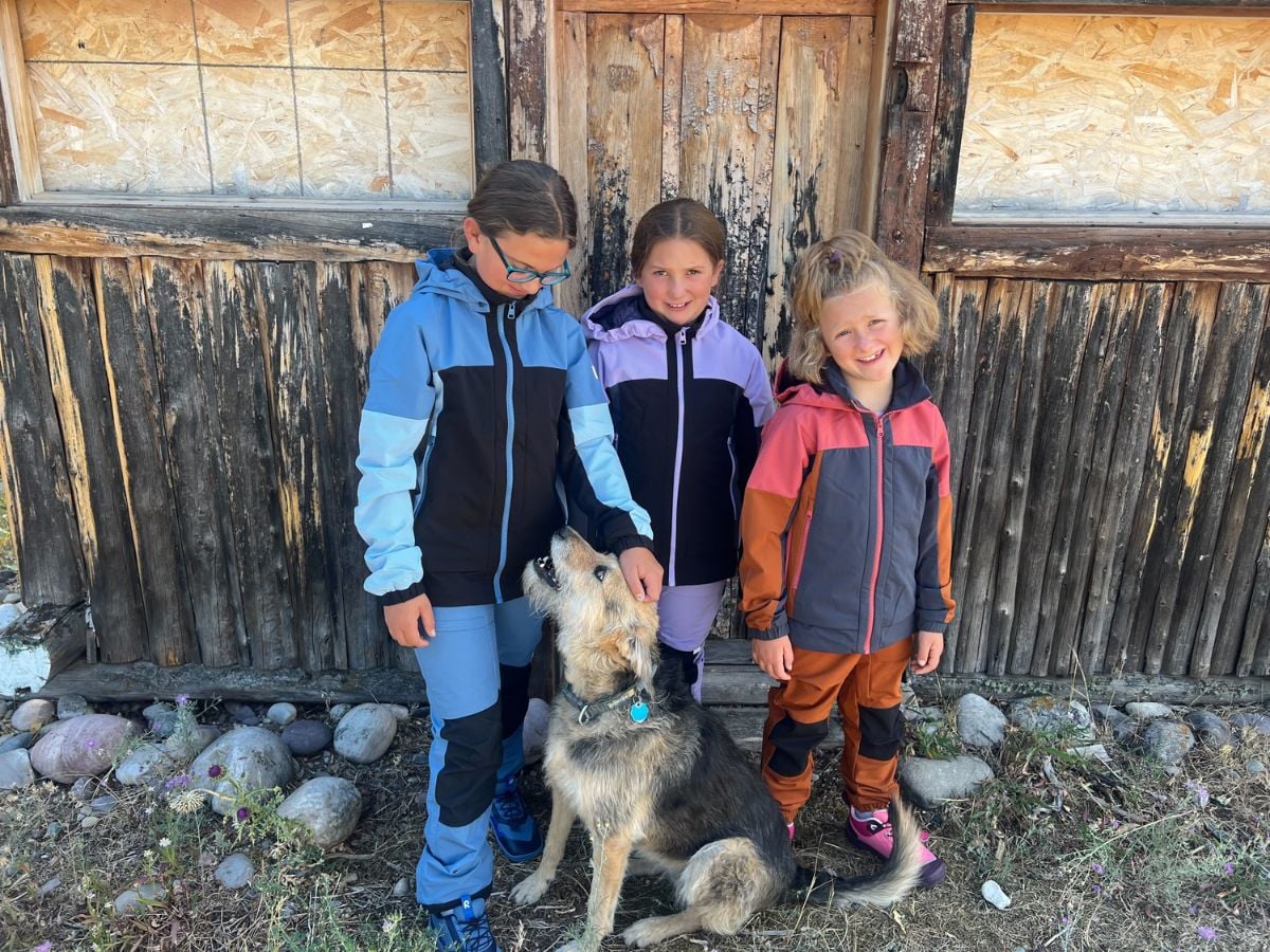 Back to School gear 10 Girls outside with their dog wearing Reima gear
