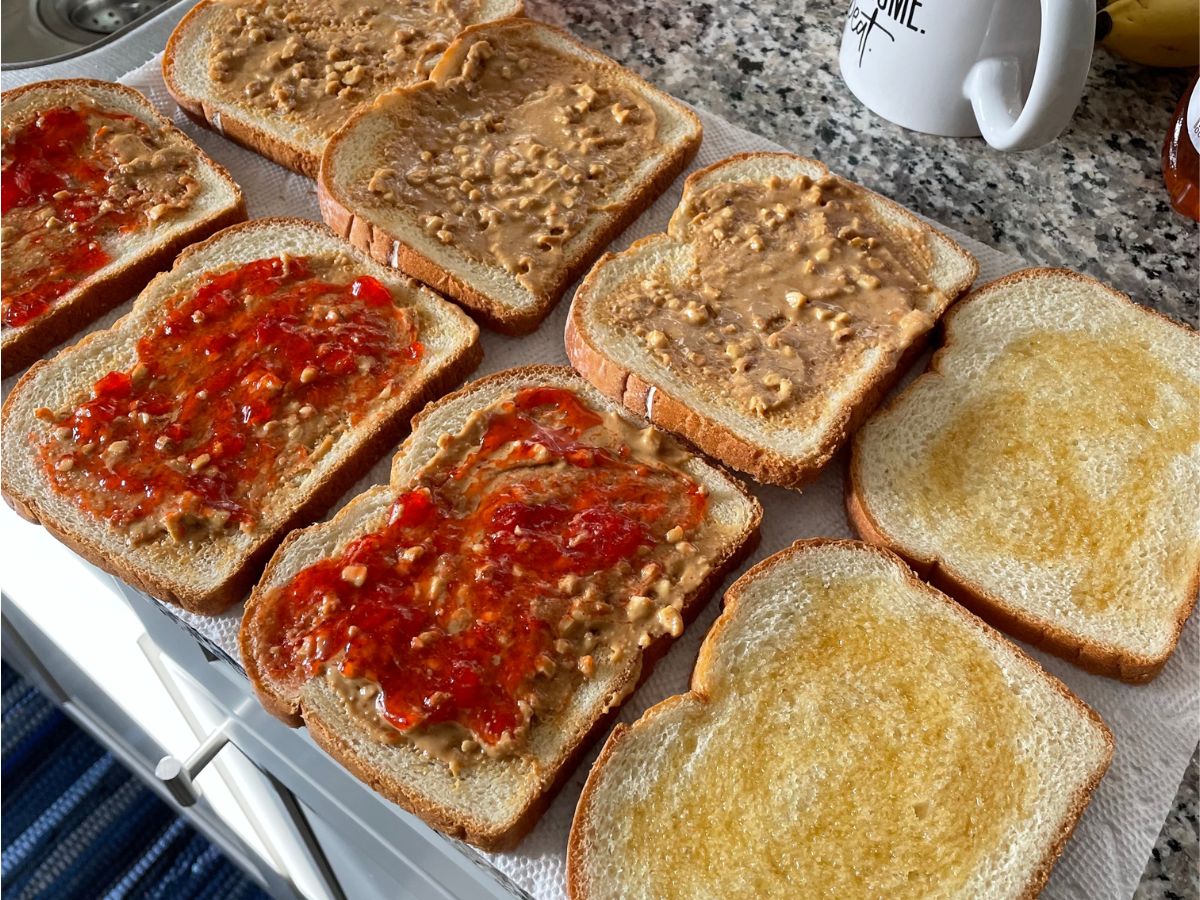 Open faced peanut butter and jam and honey and butter sandwiches