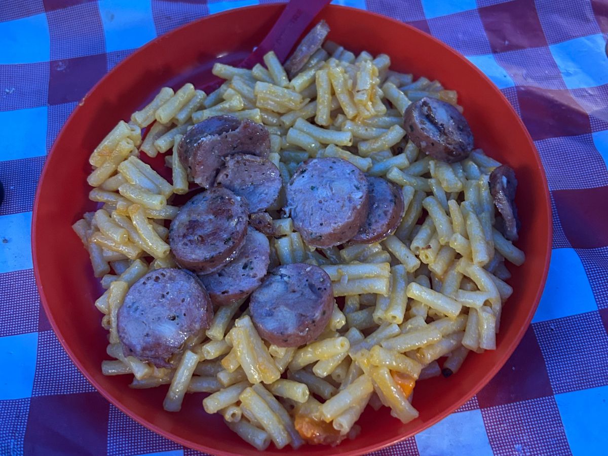 Mac n Cheese and Sausage in a red bowl