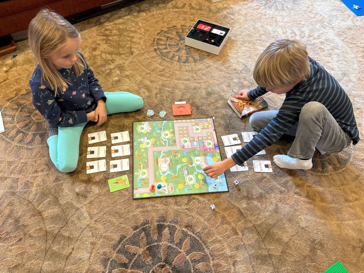 Best indoor active play gifts horizontal 14 Little girl and boy on a rung on the floor playing the game Outfoxed!