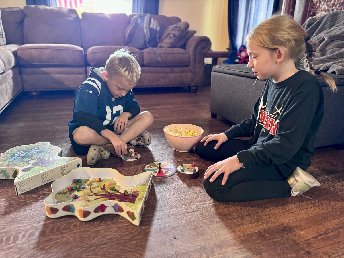 Best indoor active play gifts horizontal 15 Girl and boy sitting on the floor playing The Sneaky, Snacky Squirrel Game