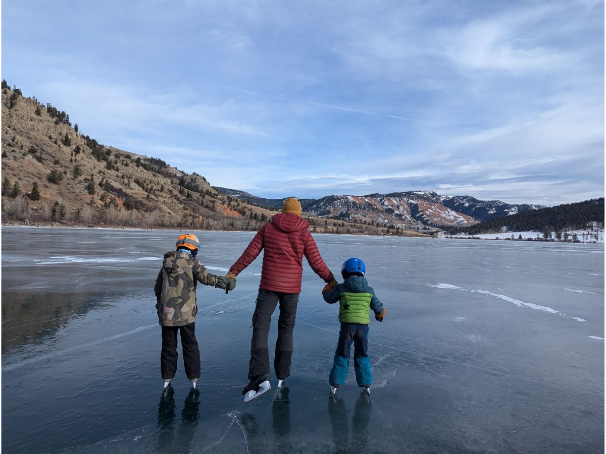 Dad and two kids ice skating