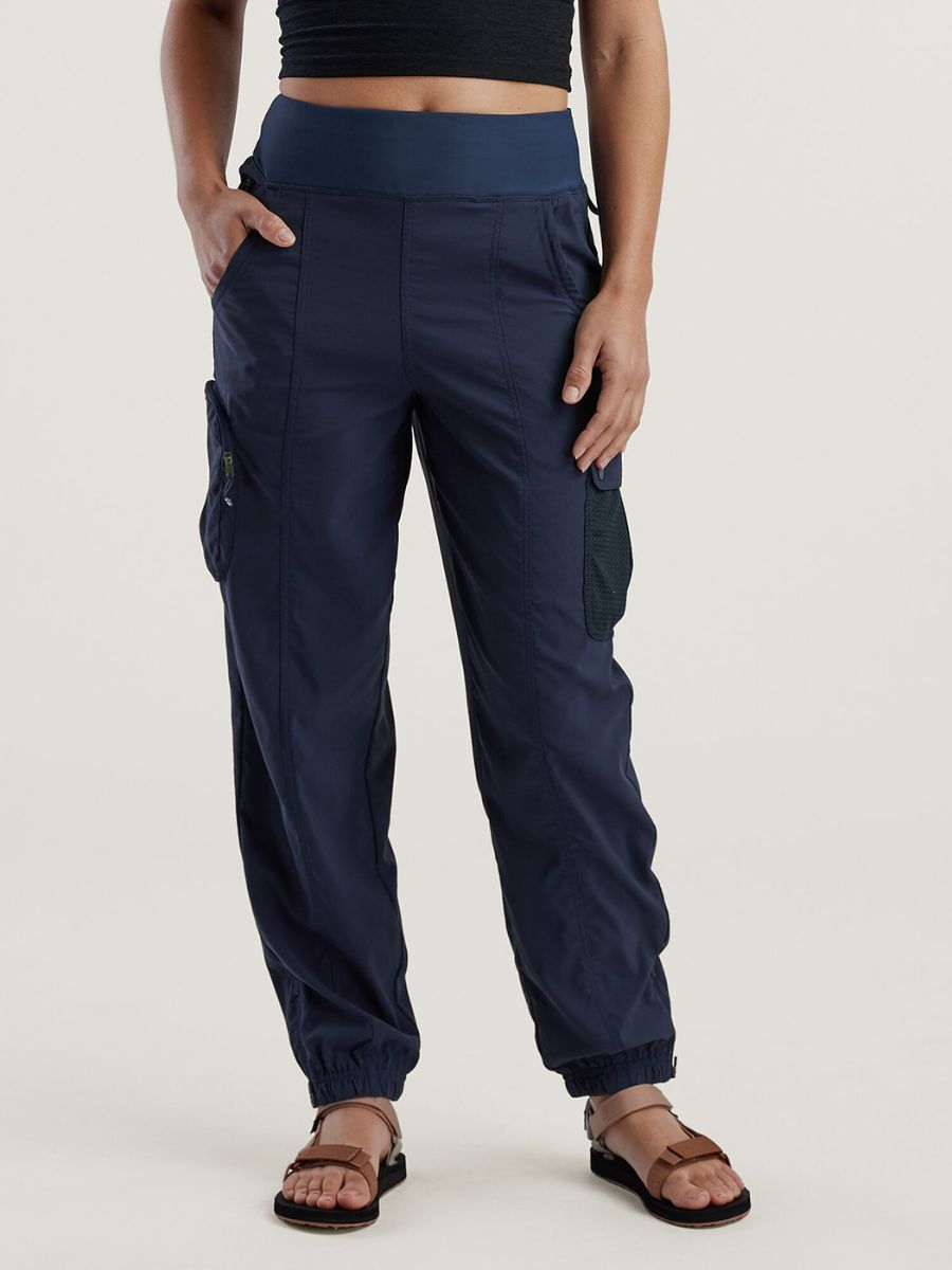 A model shows off a pair of navy blue pants