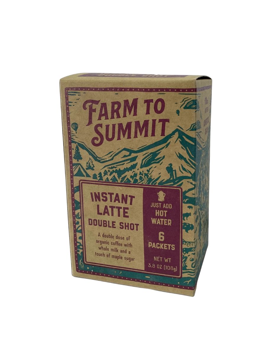 A stock image of backpacking coffee backpacking - it's cardboard with maroon letters and mountains.