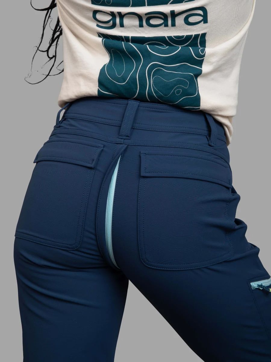 A photo of a model's backside, with a zipper exposed along the seam.