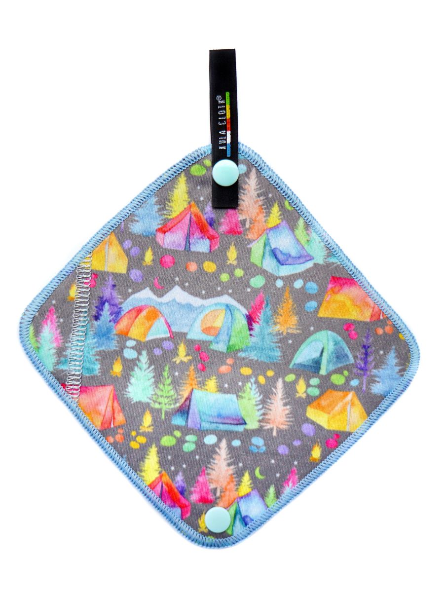 A stock image of a square piece of fabric with a colorful tents.