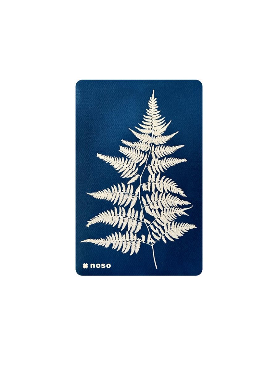 A stock image of a rectangular patch that's blue with a white fern.