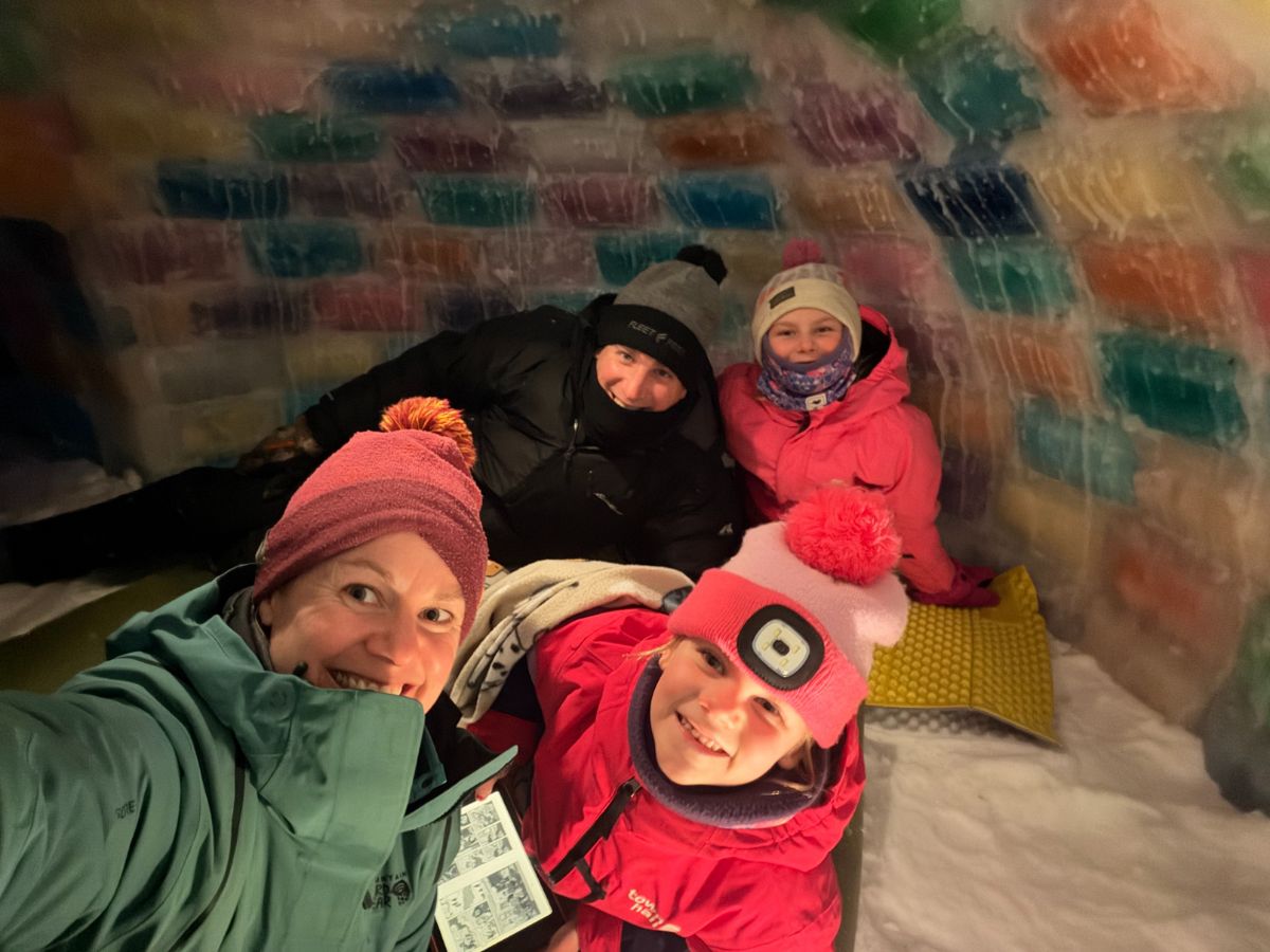 Buildaniceigloo15 A family is in a colored ice block igloo.