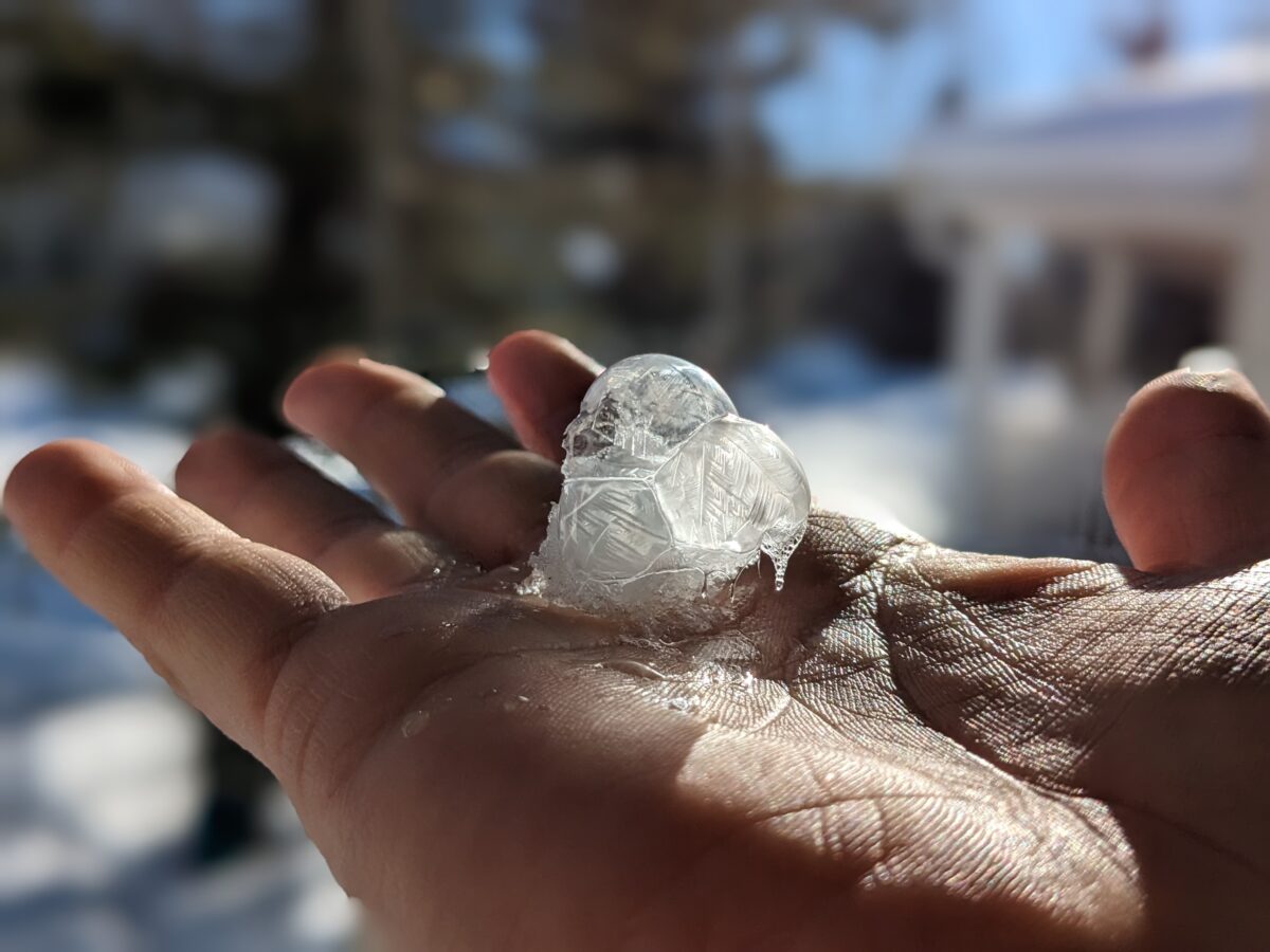 a frozen bubble in a hand.
