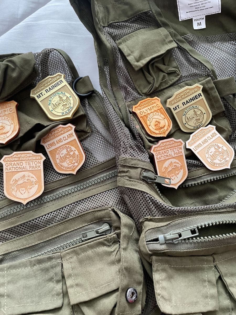 NtlParks1 Junior Ranger badges on a vest.