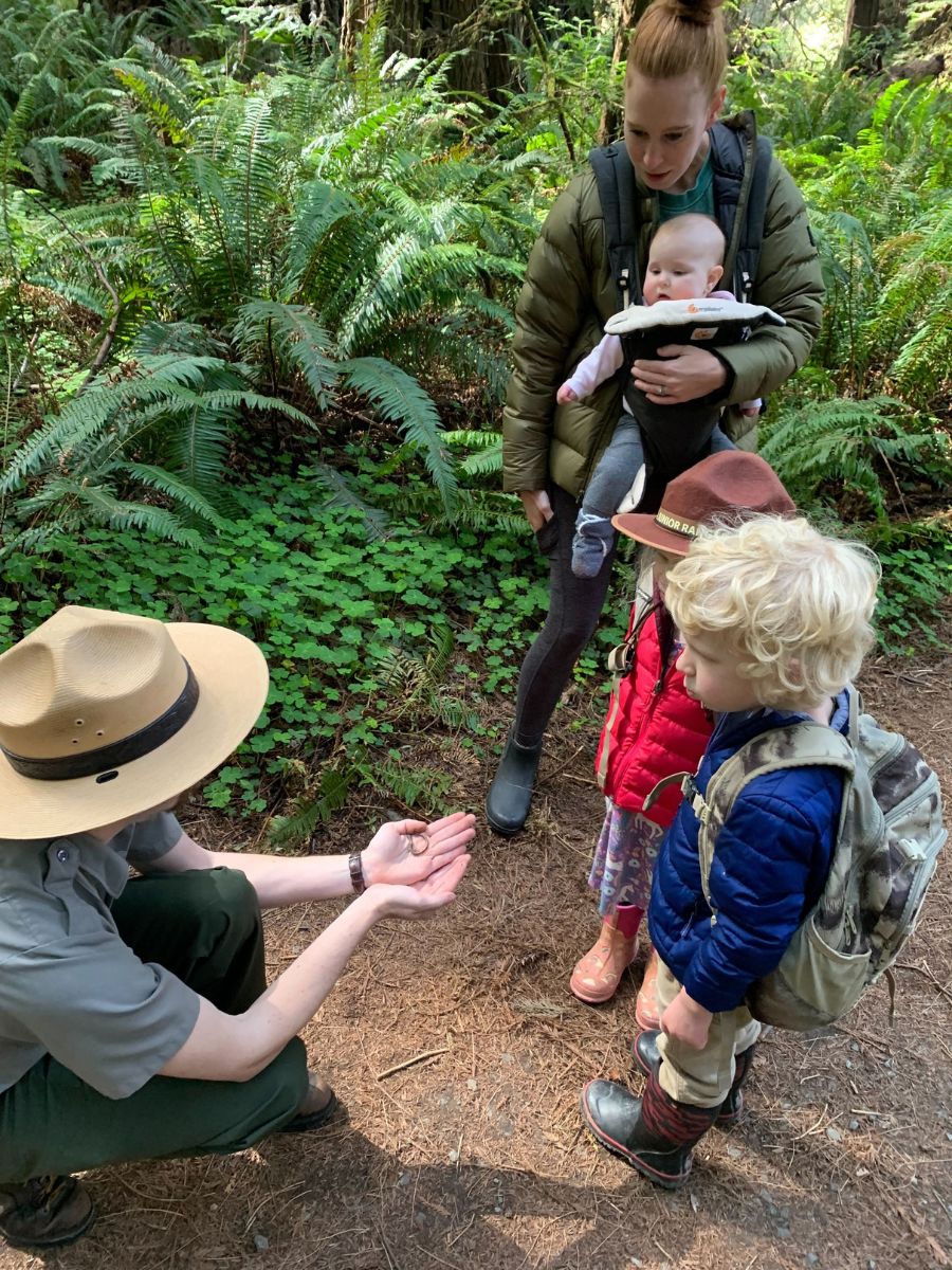 NtlParks2 A mother and 3 children listens to a National Park Ranger.