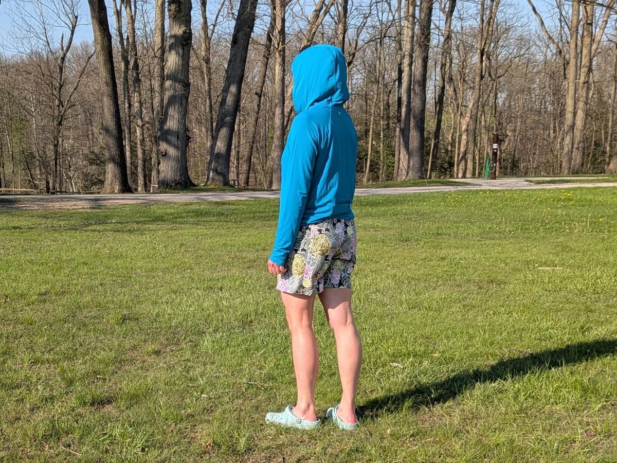 t9sunandswim_14 A person with a blue hoodie on faces away.