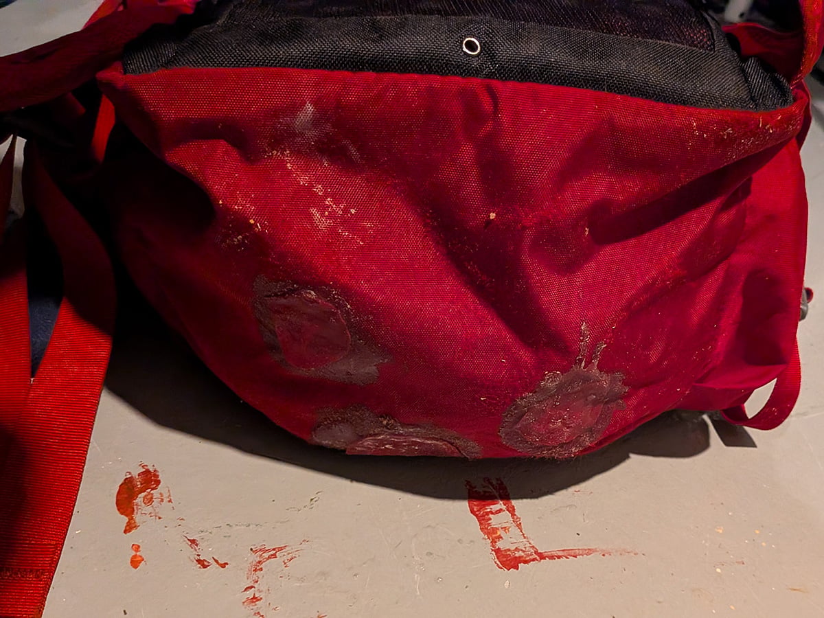 Pack that was repaired using stuff sack pieces and seam grip.