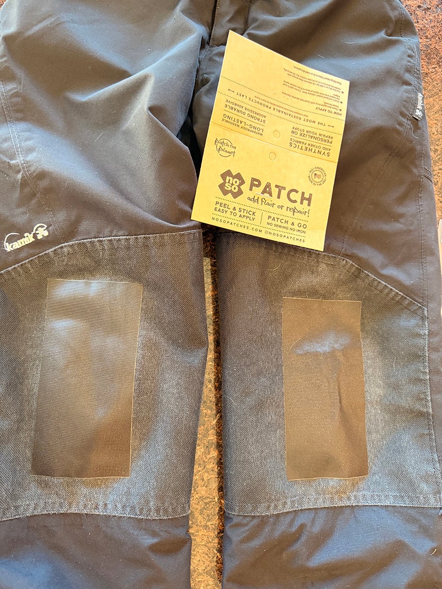 Pants repaired with No So patch. Photo includes the patch label.